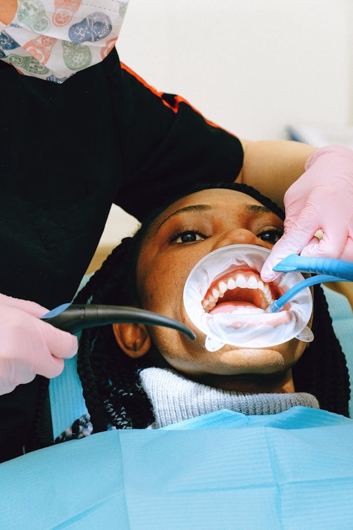 gallery-2 Close-up of a dental practitioner performing a check-up with advanced equipment. Healthcare setting.